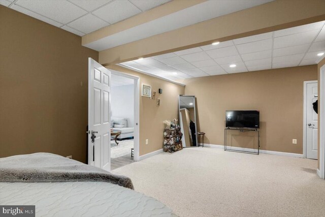  - carpeted bedroom featuring a paneled ceiling, baseboards, and recessed lighting