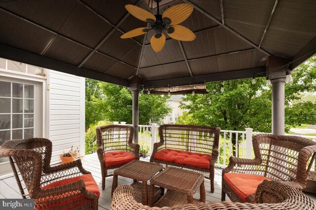  - wooden terrace featuring a gazebo, ceiling fan, and an outdoor hangout area
