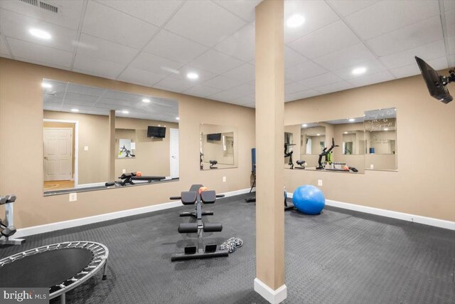  - gym featuring baseboards, a paneled ceiling, recessed lighting, and carpet floors