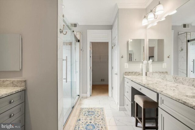  - bathroom with a stall shower, ornamental molding, vanity, a walk in closet, and marble finish floors