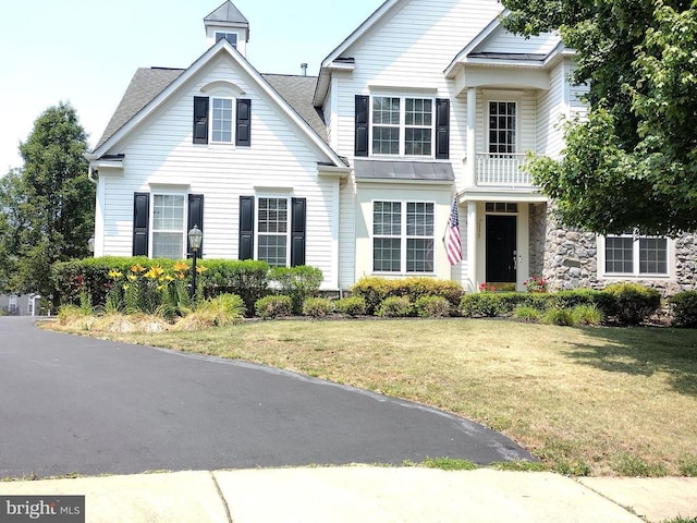  - view of front facade with a front yard