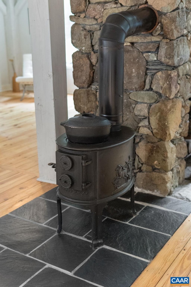 5875 Burnett Ln, Advance Mills, VA 22968 - detailed view of a wood stove and wood finished floors