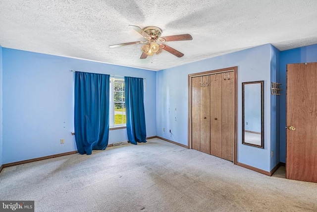3716 Martin Kings Rd, Charlottesville, VA 22902 - unfurnished bedroom with carpet flooring, a textured ceiling, a closet, and ceiling fan