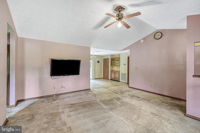 3716 Martin Kings Rd, Charlottesville, VA 22902 - unfurnished living room with ceiling fan, carpet flooring, a textured ceiling, and vaulted ceiling
