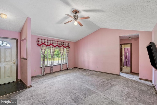 3716 Martin Kings Rd, Charlottesville, VA 22902 - unfurnished living room featuring ceiling fan, lofted ceiling, carpet, and a textured ceiling