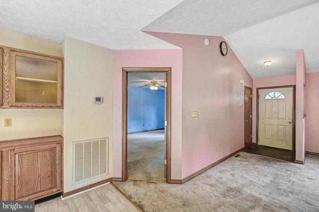 3716 Martin Kings Rd, Charlottesville, VA 22902 - entryway with light carpet, lofted ceiling, ceiling fan, and a textured ceiling