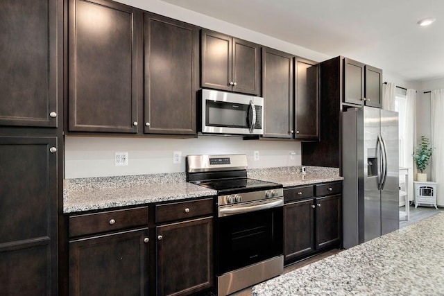 301 Willowshire Ct, Waynesboro, VA 22980 - kitchen with stainless steel appliances, dark brown cabinetry, light stone countertops, and recessed lighting