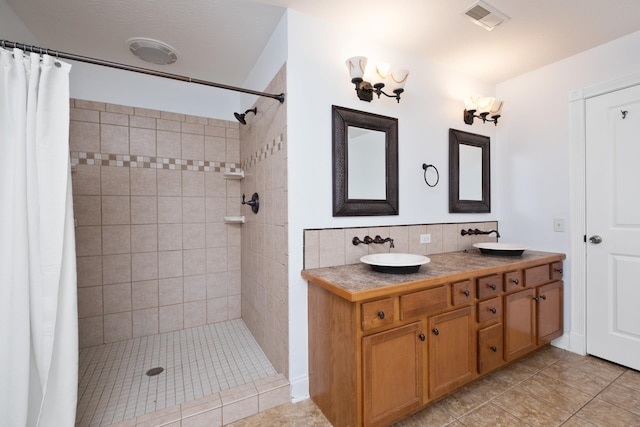 109 Leavel Ct, Bridgewater, VA 22812 - full bath with tiled shower, double vanity, tile patterned flooring, and backsplash