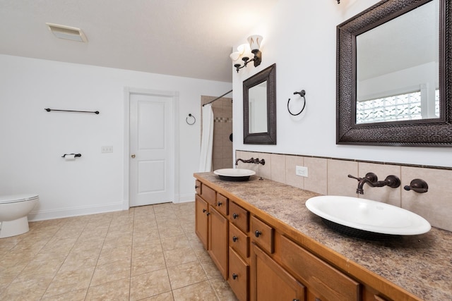 109 Leavel Ct, Bridgewater, VA 22812 - bathroom featuring double vanity, toilet, curtained shower, backsplash, and tile patterned floors