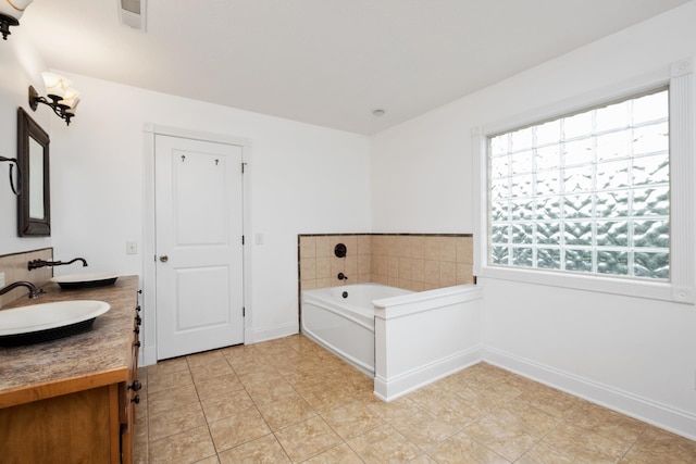 109 Leavel Ct, Bridgewater, VA 22812 - bathroom with double vanity, a garden tub, baseboards, and tile patterned flooring