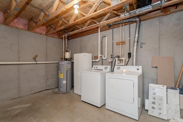 basement with water heater and washing machine and clothes dryer