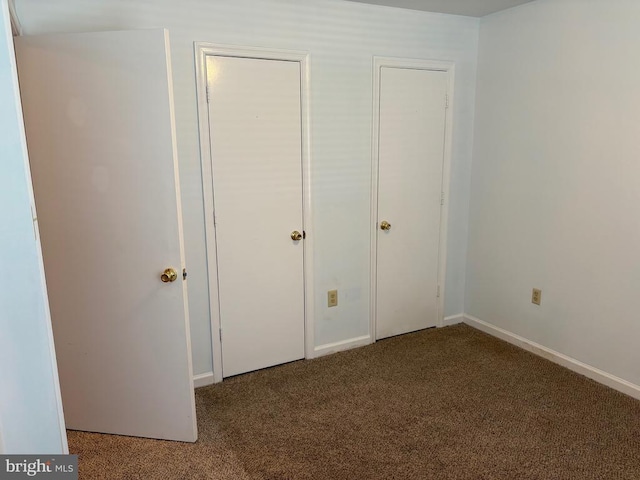 319 Fox Hunters Ln, Madison, VA 22727 - unfurnished bedroom with carpet floors and baseboards