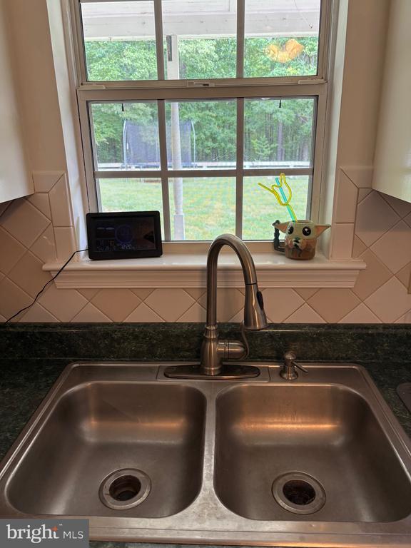 319 Fox Hunters Ln, Madison, VA 22727 - kitchen view of a sink and decorative backsplash
