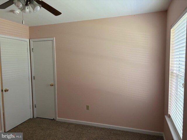319 Fox Hunters Ln, Madison, VA 22727 - unfurnished bedroom featuring carpet floors, baseboards, and a ceiling fan