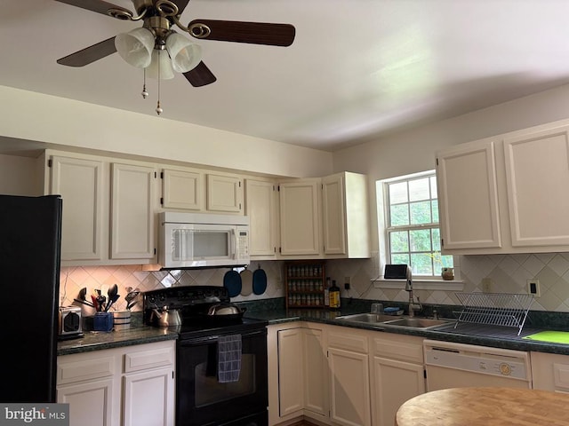 319 Fox Hunters Ln, Madison, VA 22727 - kitchen featuring black appliances, a sink, decorative backsplash, and dark countertops