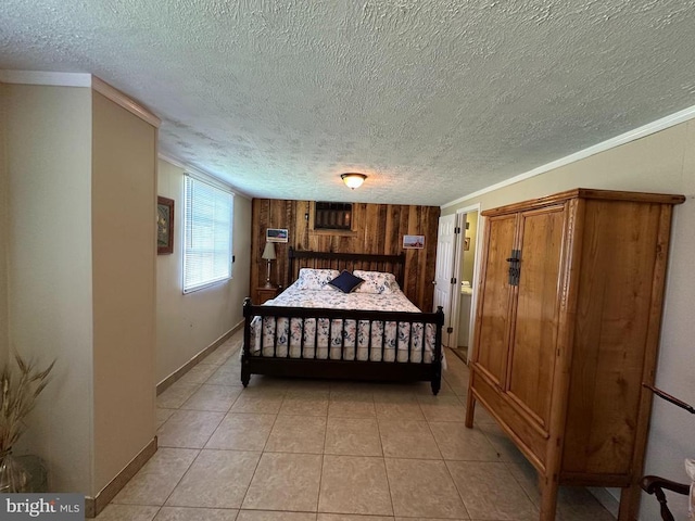 379 Shenk Hollow Rd, Luray, VA 22835 - bedroom with ornamental molding, a textured ceiling, wood walls, light tile patterned floors, and baseboards