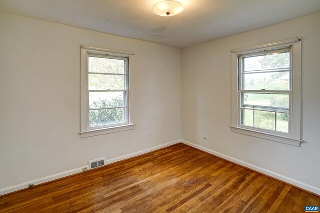 807 Hillcrest Rd, Charlottesville, VA 22903 - empty room with baseboards, plenty of natural light, and wood finished floors