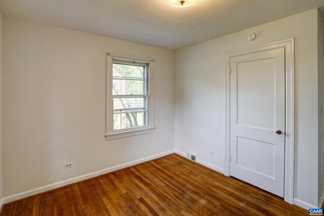 807 Hillcrest Rd, Charlottesville, VA 22903 - empty room with dark wood finished floors, baseboards, and a smoke detector