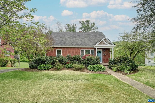 807 Hillcrest Rd, Charlottesville, VA 22903 - view of front facade featuring brick siding, roof with shingles, a front lawn, and a chimney