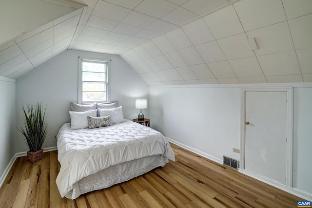 807 Hillcrest Rd, Charlottesville, VA 22903 - bedroom featuring wood finished floors, baseboards, and vaulted ceiling