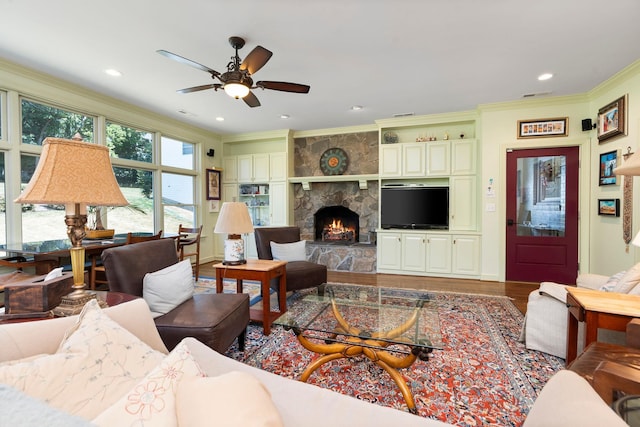 1204 Westmoreland Dr, Staunton, VA 24401 - living area with crown molding, wood finished floors, ceiling fan, a stone fireplace, and recessed lighting