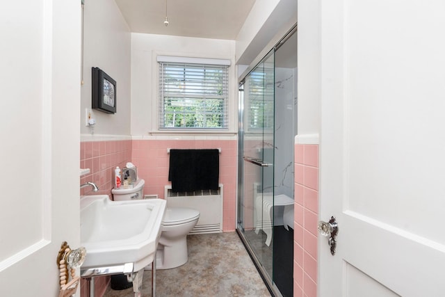 1204 Westmoreland Dr, Staunton, VA 24401 - bathroom featuring radiator, tile walls, a stall shower, toilet, and a wainscoted wall
