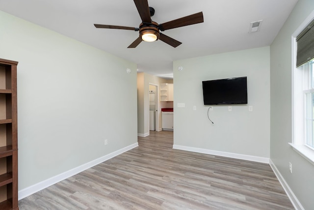 1204 Westmoreland Dr, Staunton, VA 24401 - unfurnished living room featuring ceiling fan, light wood-style floors, healthy amount of natural light, and baseboards