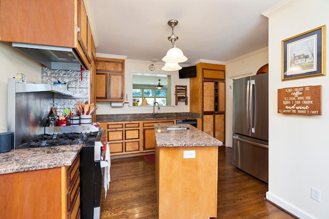 1204 Westmoreland Dr, Staunton, VA 24401 - kitchen featuring stainless steel appliances, brown cabinets, a center island, crown molding, and dark wood-style floors
