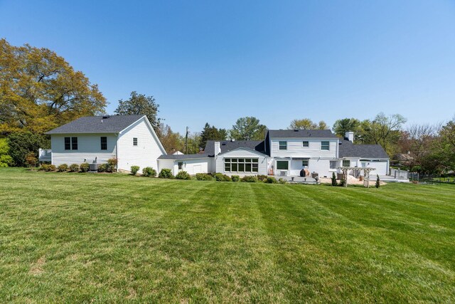 1204 Westmoreland Dr, Staunton, VA 24401 - back of property with a lawn and central AC unit