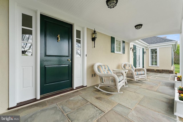 8300 Falcon Glen Rd, Warrenton, VA 20186 - doorway to property with a porch and stucco siding
