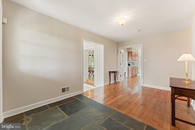 8300 Falcon Glen Rd, Warrenton, VA 20186 - unfurnished room featuring wood finished floors, visible vents, and baseboards
