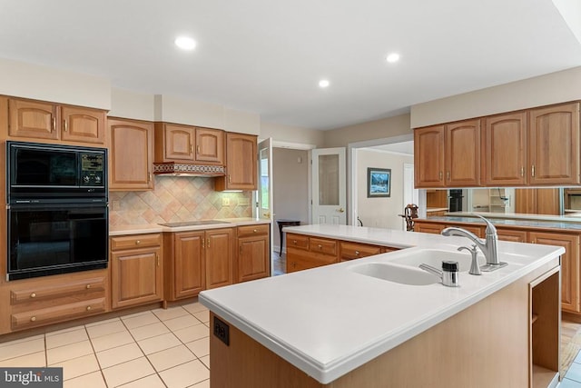 8300 Falcon Glen Rd, Warrenton, VA 20186 - kitchen featuring a sink, a spacious island, black appliances, decorative backsplash, and custom range hood