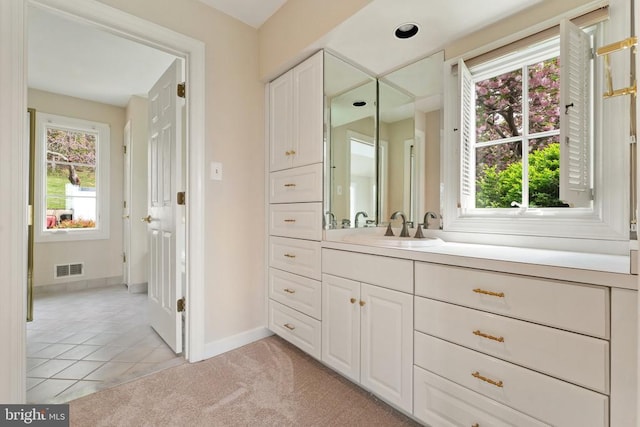 8300 Falcon Glen Rd, Warrenton, VA 20186 - bathroom featuring vanity, baseboards, visible vents, and tile patterned flooring