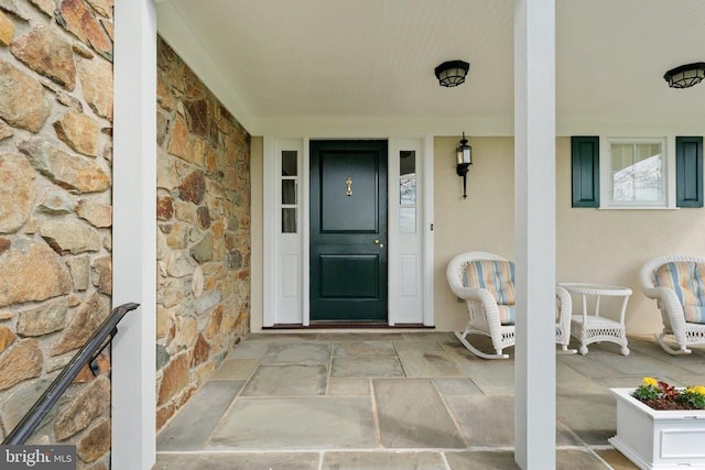 8300 Falcon Glen Rd, Warrenton, VA 20186 - doorway to property featuring a porch and stone siding