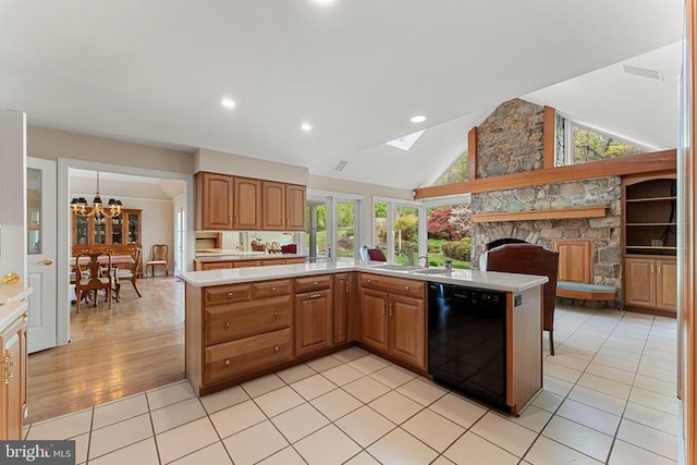 8300 Falcon Glen Rd, Warrenton, VA 20186 - kitchen featuring plenty of natural light, dishwasher, a sink, light countertops, and a fireplace