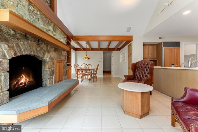 8300 Falcon Glen Rd, Warrenton, VA 20186 - living area with baseboards, a stone fireplace, visible vents, light tile patterned flooring, and vaulted ceiling