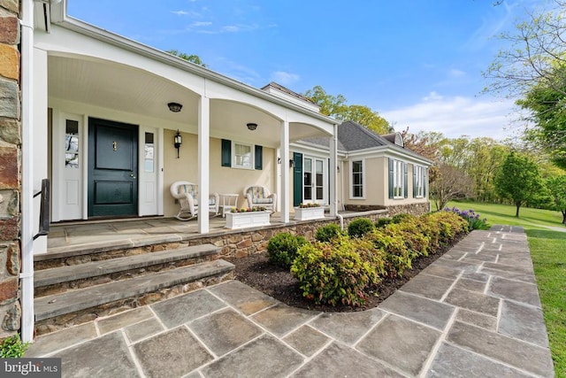 8300 Falcon Glen Rd, Warrenton, VA 20186 - entrance to property with covered porch and stucco siding