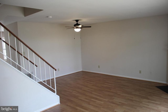 5151 Dominion Dr, Fredericksburg, VA 22407 - unfurnished living room featuring ceiling fan, stairs, baseboards, and wood finished floors