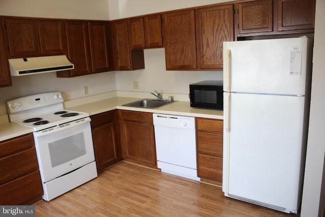 5151 Dominion Dr, Fredericksburg, VA 22407 - kitchen featuring range hood, white appliances, a sink, light wood-style floors, and light countertops