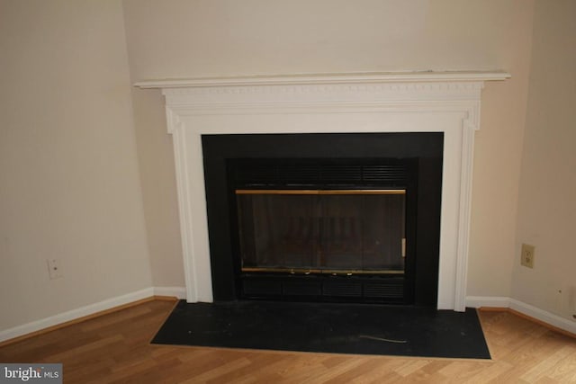 5151 Dominion Dr, Fredericksburg, VA 22407 - room details featuring baseboards, a fireplace with flush hearth, and wood finished floors