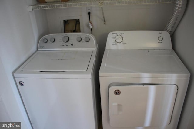 5151 Dominion Dr, Fredericksburg, VA 22407 - laundry room featuring separate washer and dryer and laundry area