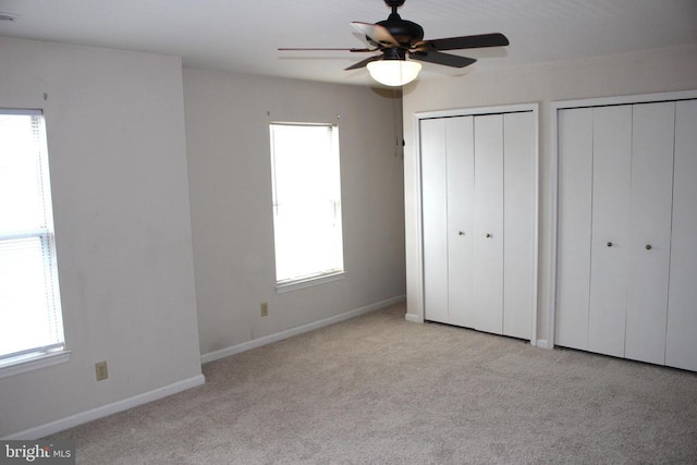 5151 Dominion Dr, Fredericksburg, VA 22407 - unfurnished bedroom featuring carpet, multiple windows, and multiple closets