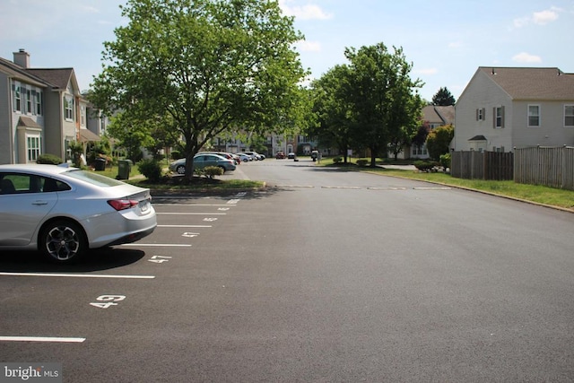 5151 Dominion Dr, Fredericksburg, VA 22407 - uncovered parking lot with fence and a residential view