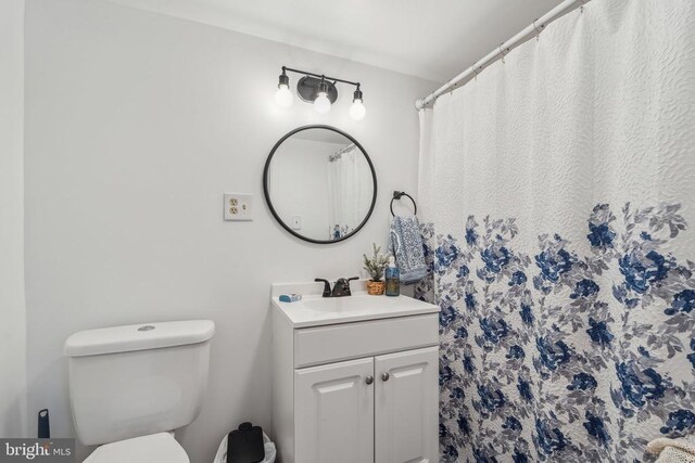  - full bathroom with vanity and a shower with curtain