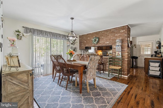  - dining area featuring hardwood / wood-style flooring, a chandelier, and ornamental molding