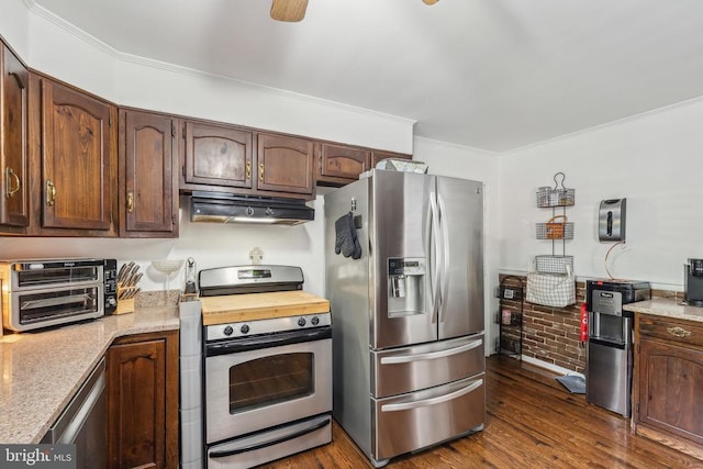  - kitchen with stainless steel appliances, under cabinet range hood, ornamental molding, and dark wood finished floors