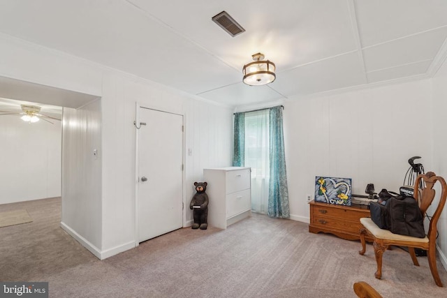  - sitting room with crown molding, light carpet, and ceiling fan