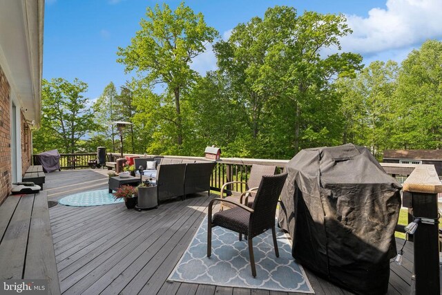  - wooden deck with outdoor lounge area and grilling area