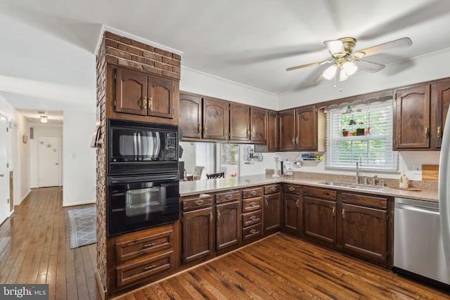  - kitchen with black appliances, ceiling fan, light countertops, dark wood-type flooring, and ornamental molding