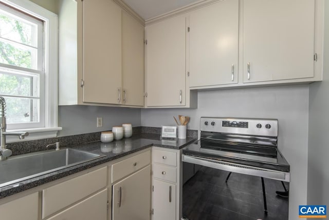 238 Old Lynchburg Rd, Charlottesville, VA 22903 - kitchen with electric stove, a sink, dark countertops, and white cabinetry